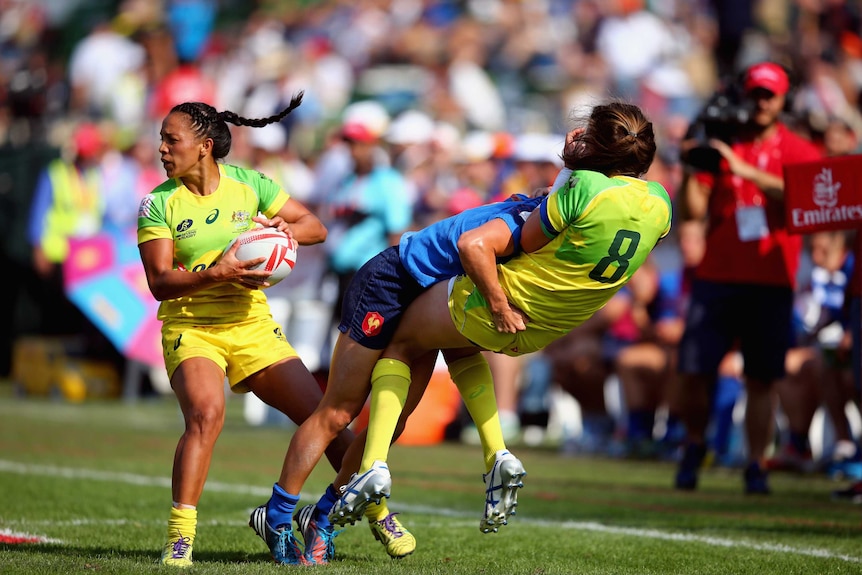 Chloe Dalton of Australia is tackled by Audrey Amiel of France