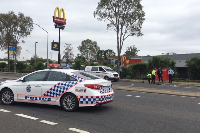 Police cars and officers at scene where male constable was hit by a car in Brisbane Street at Booval.