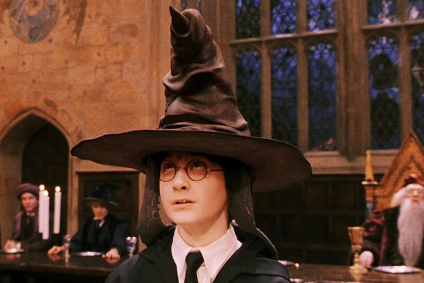 Harry Potter (Daniel Radcliffe) wearing the Hogwarts sorting hat in Harry Potter and the Philosopher's Stone 2001.