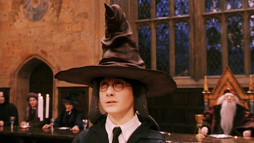 Harry Potter (Daniel Radcliffe) wearing the Hogwarts sorting hat in Harry Potter and the Philosopher's Stone 2001.