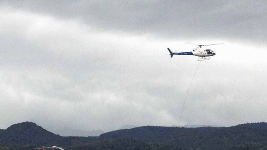 A water-bombing helicopter outside Zeehan on Tasmania's west coast