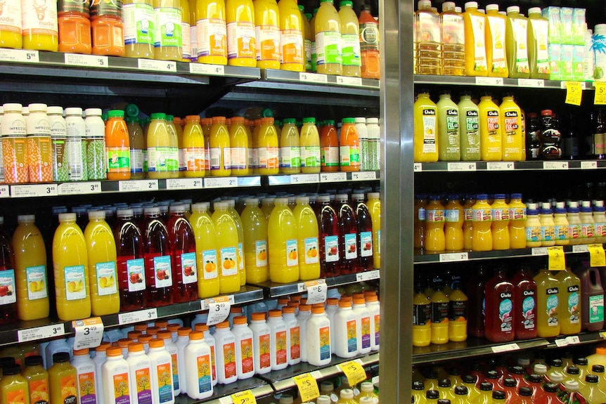 Shelves of fruit juice in supermarket fridges in Sydney store