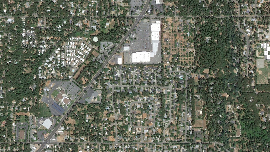 A satellite image showing the Paradise Plaza, a shopping centre that sits in suburbia in the US town of Paradise.