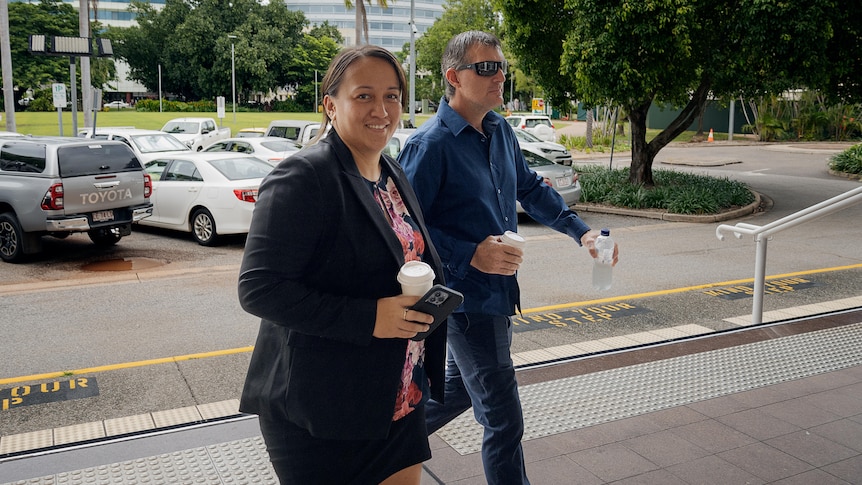 a woman and man entering court in darwin