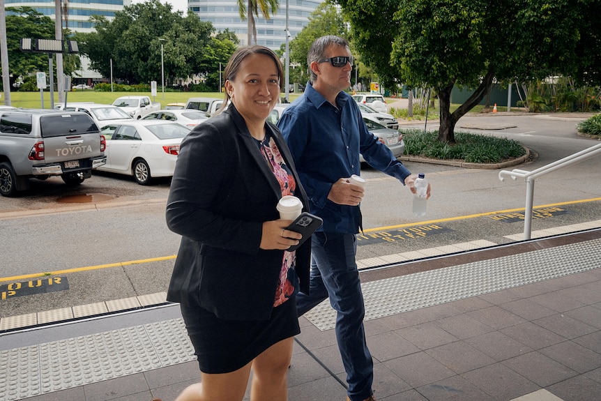 a woman and man entering court in darwin