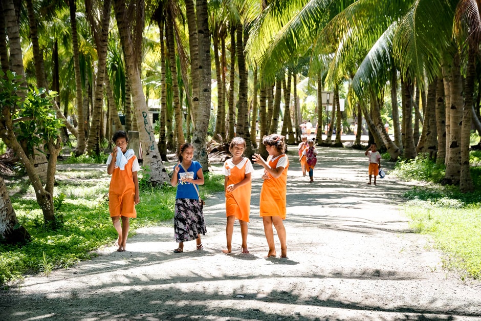Coconut trees obscure basketball court on Kiribati
