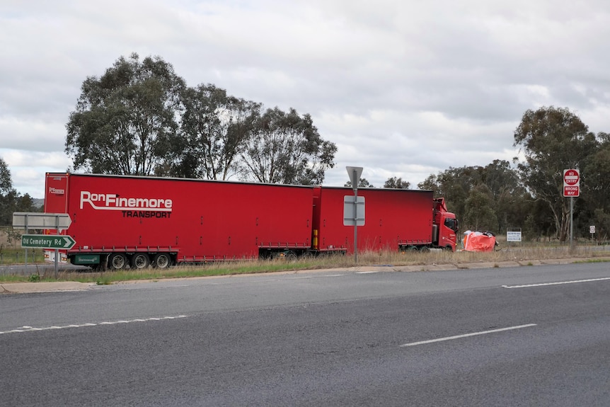 A B-double truck the scene of a deadly collision between it and a car on the Hume Freeway 