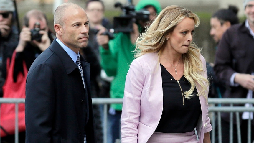 Stormy Daniels and her attorney Michael Avenatti leave federal court in New York.