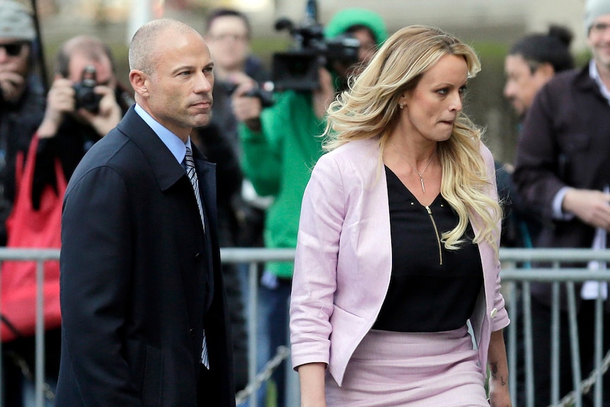 Stormy Daniels and her attorney Michael Avenatti leave federal court in New York.