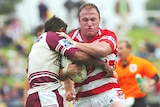Luke Bailey of the Sea Eagles clashes with Andrew Walker from the Dragons
