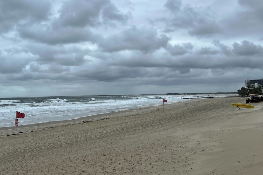 Storm clouds over the closed Kings Beach at Caloundra