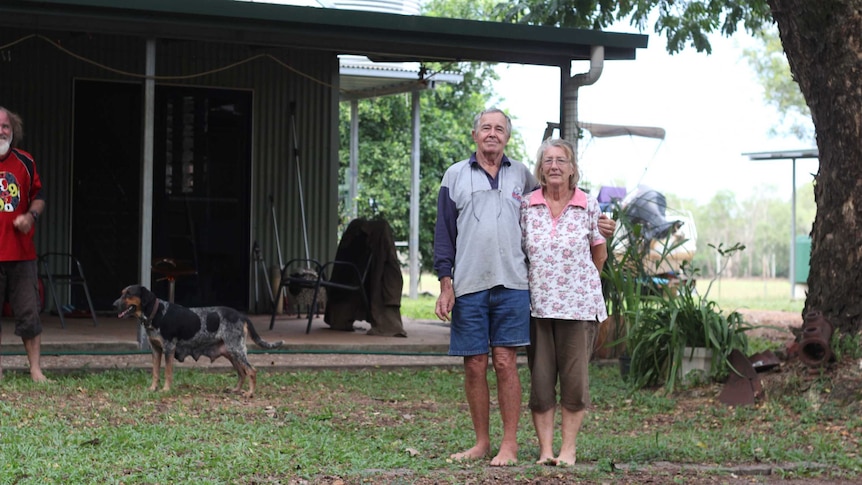 A couple outside a house