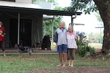 A couple outside a house