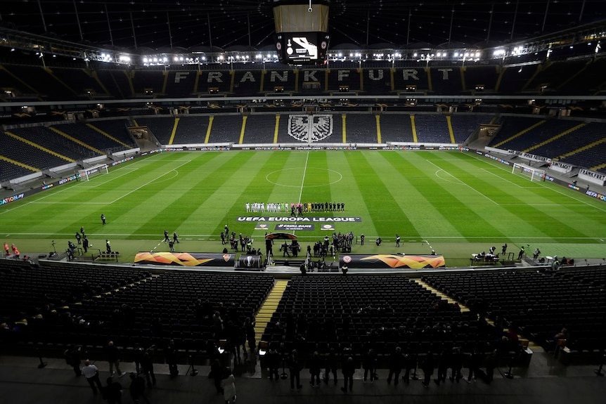 A soccer field without any fans.