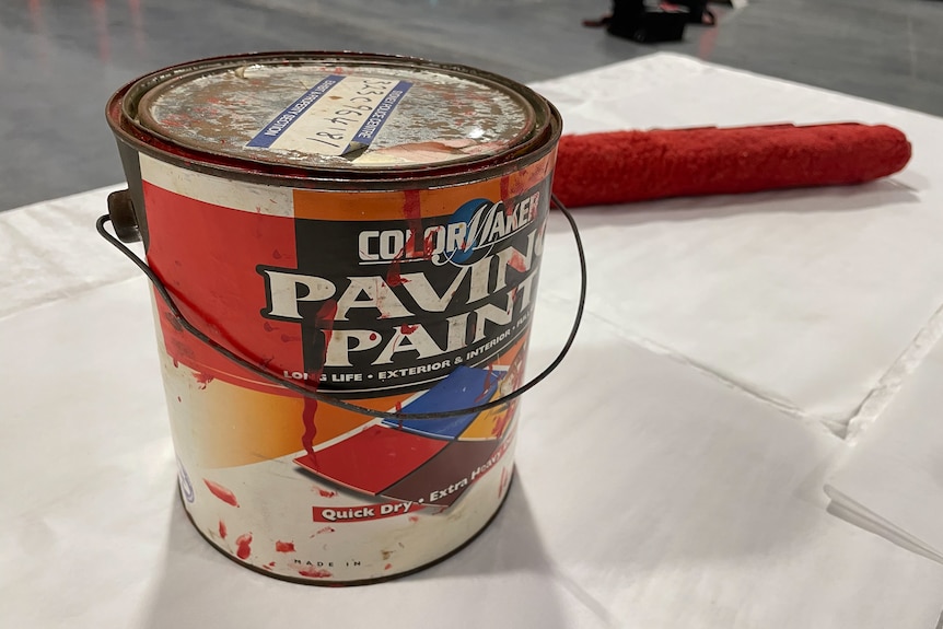 Old tin of red paint. 