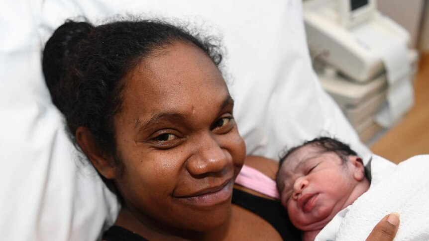 Samantha Kerr lies in a hospital bed with her new born baby boy Cordy Kerr-Kennedy in Townsville