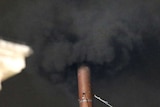 Black smoke billows from chimney at the Vatican