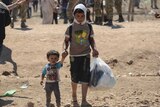 Two Syrian boys flee to Turkey from Syria