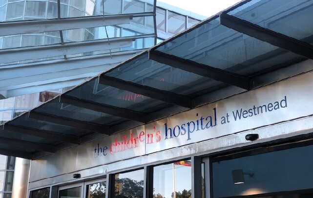 A sign on a building that reads: The Children's Hospital at Westmead