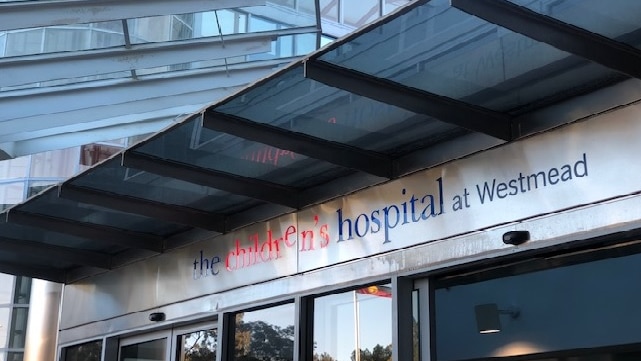 A sign on a building that reads: The Children's Hospital at Westmead