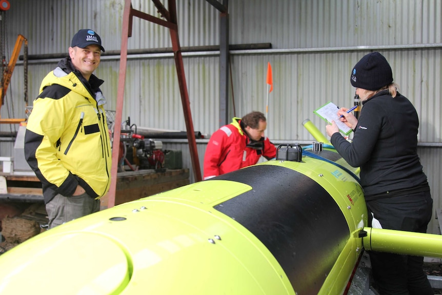Erica Spain and Ben Galton Fenzi with the AUV