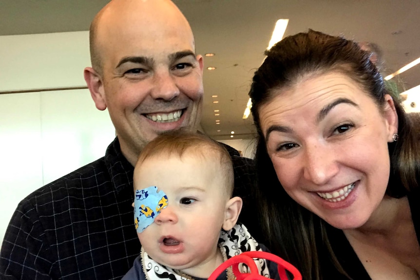 Stacey Alexander with her son Hamish, who is wearing an eye patch.