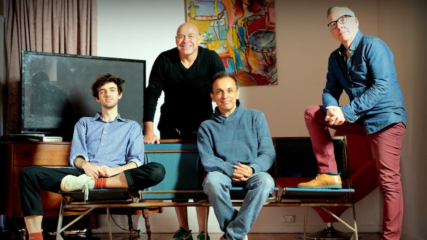 Four men and a bench seat — the cast and set of the play 'Sidelined'.