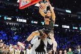 Aaron Gordon leaps over Tacko Fall in the dunk contest