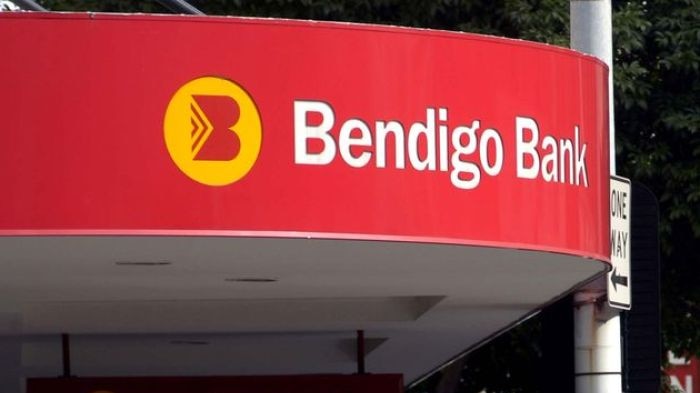 People walk past a Bendigo Bank branch