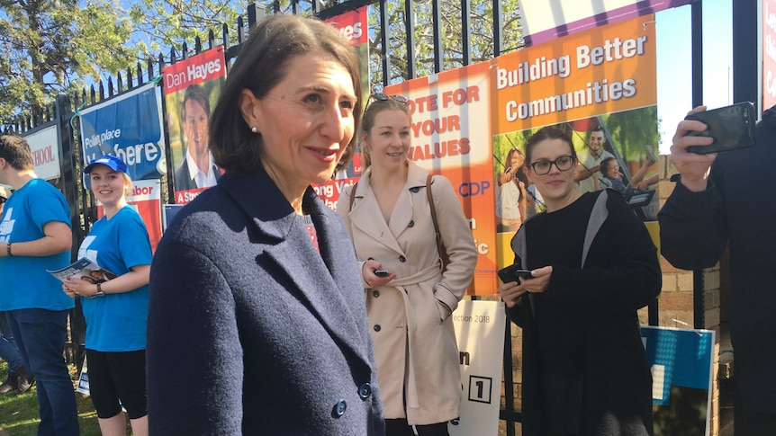 Gladys Berejiklian stands in front of campaign posters at the Wagga Wagga byelection