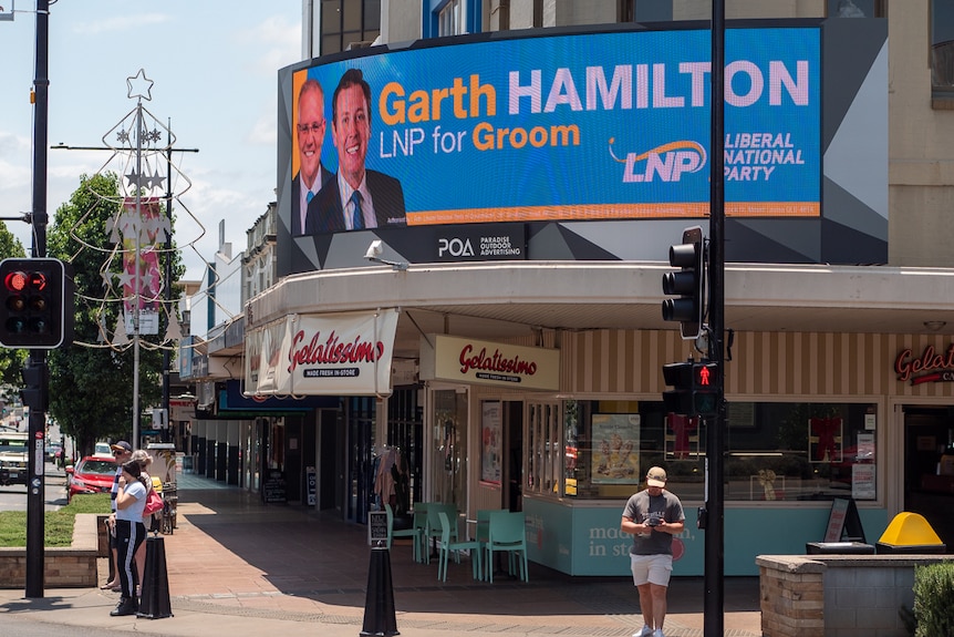 Intersection in Toowoomba CBD showing large sign for by-election candidate Garth Hamilton
