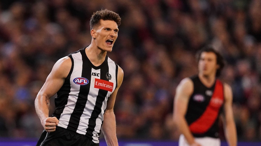 Brody Mihocek pumps his fist as he celebrates a goal for Collingwood