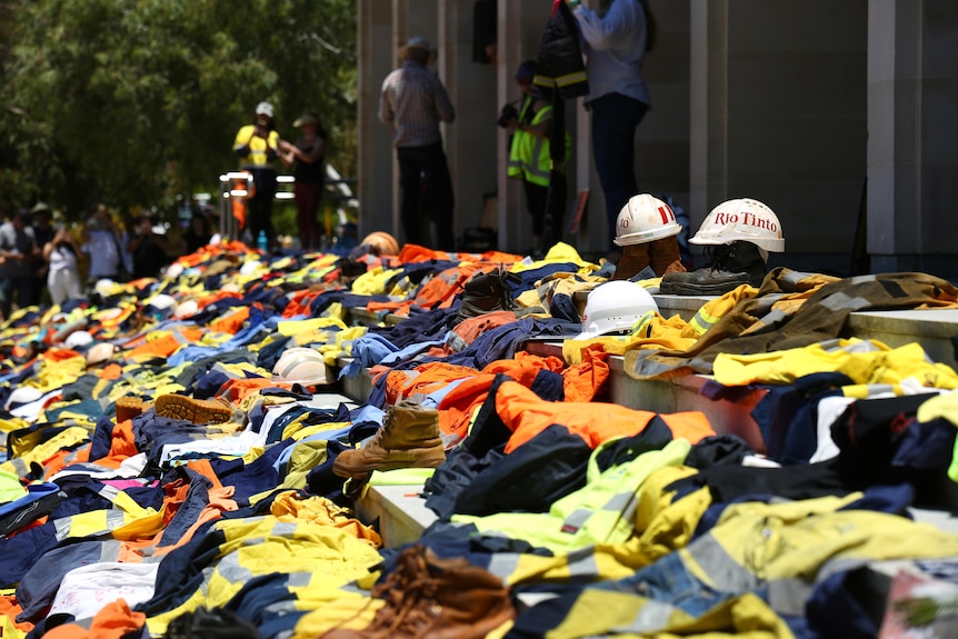 A pile of hi-vis wear laid on the steps of parliament house
