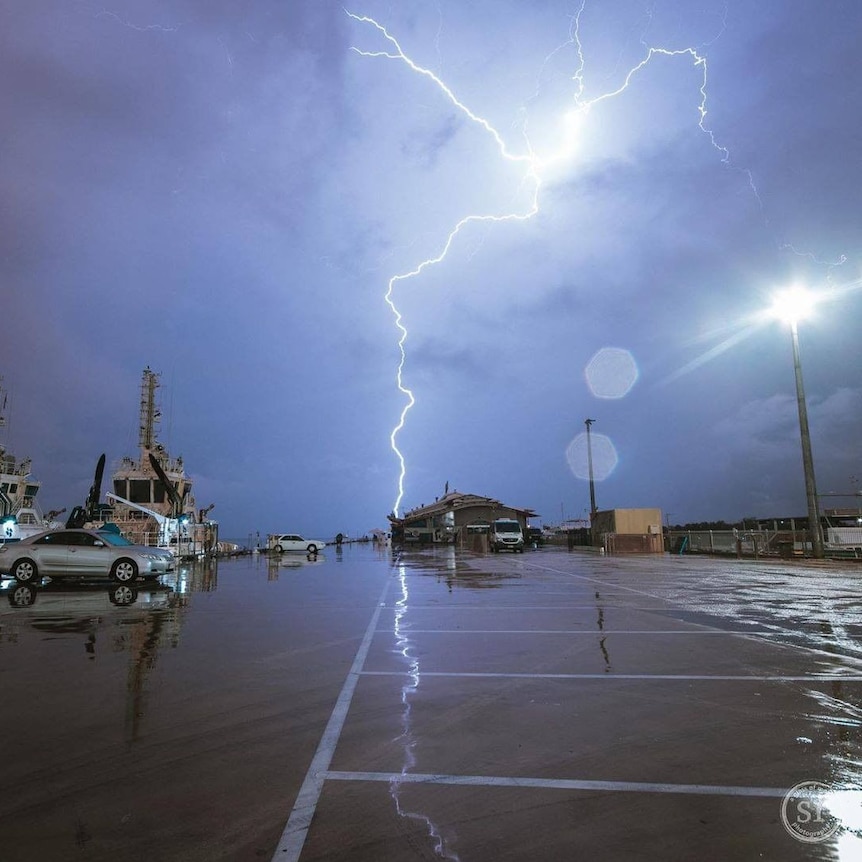 A storm can be seen cracking over Darwin's Stokes Hill Wharf.