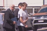 TV still of Gable Tostee taken into police custody. August 15, 2014.