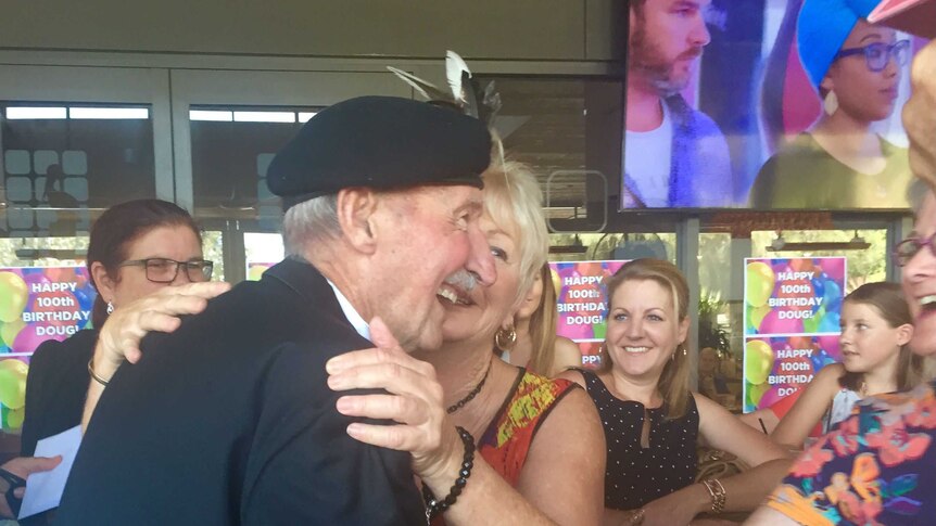 Doug Cunningham celebrates his 100th birthday surrounded by 100 women in Newcastle.