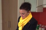 Jacquie Lambie, Palmer United Party Senate hopeful, fills a kettle in her kitchen.