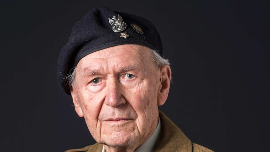 Portrait of an elderly man in World War Two army medals and uniform