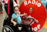 Miss Lollipop (Radio Lollipop Mascot) and patient Kaitlyn Spraggon in Brisbane.