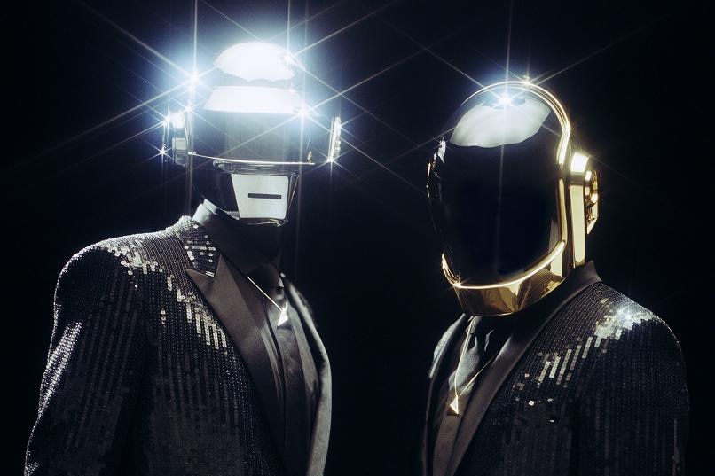 Daft Punk, two men wearing helmets.
