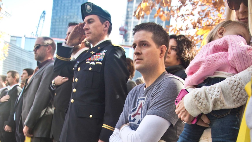 U.S. Air Force Senior Airman Brian Kolfage, center, sits in a wheelchair next to his wife Ashley.