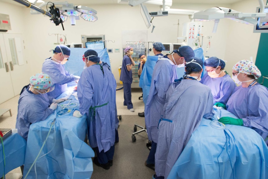 Twins Nima and Dawa in the operating theatre after successfully being separated