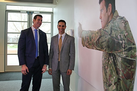 Corporal Ben Roberts-Smith confronts his life-size portrait at the Australian War Memorial, with artist Michael Zavros.