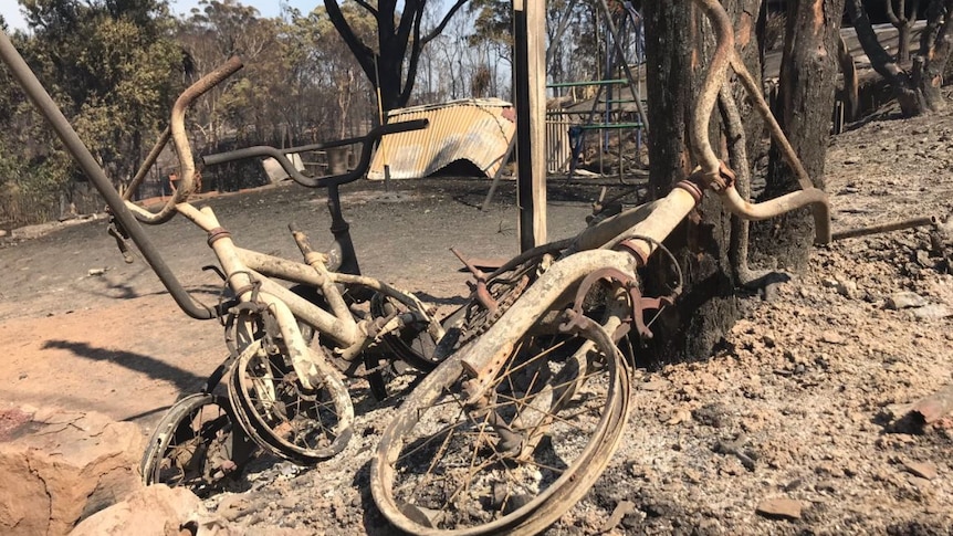 Burnt bike and swing set.