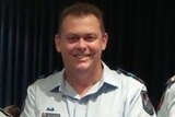 Constable Neil Punchard standing in his uniform.