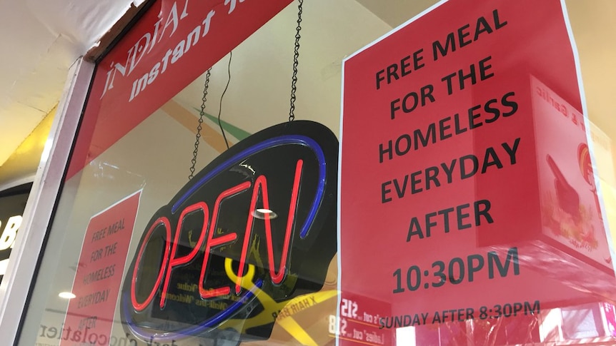 A sign advertising 'free meals for the homeless''
