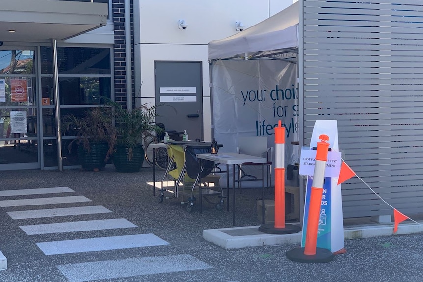 The outside of an aged care facility with barriers in front of it.