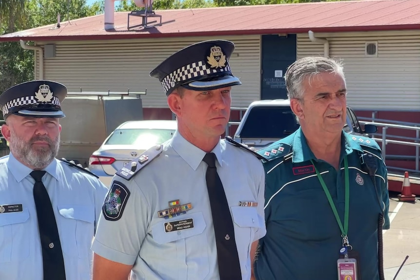 two police officers and an ambulance officer give a press conference