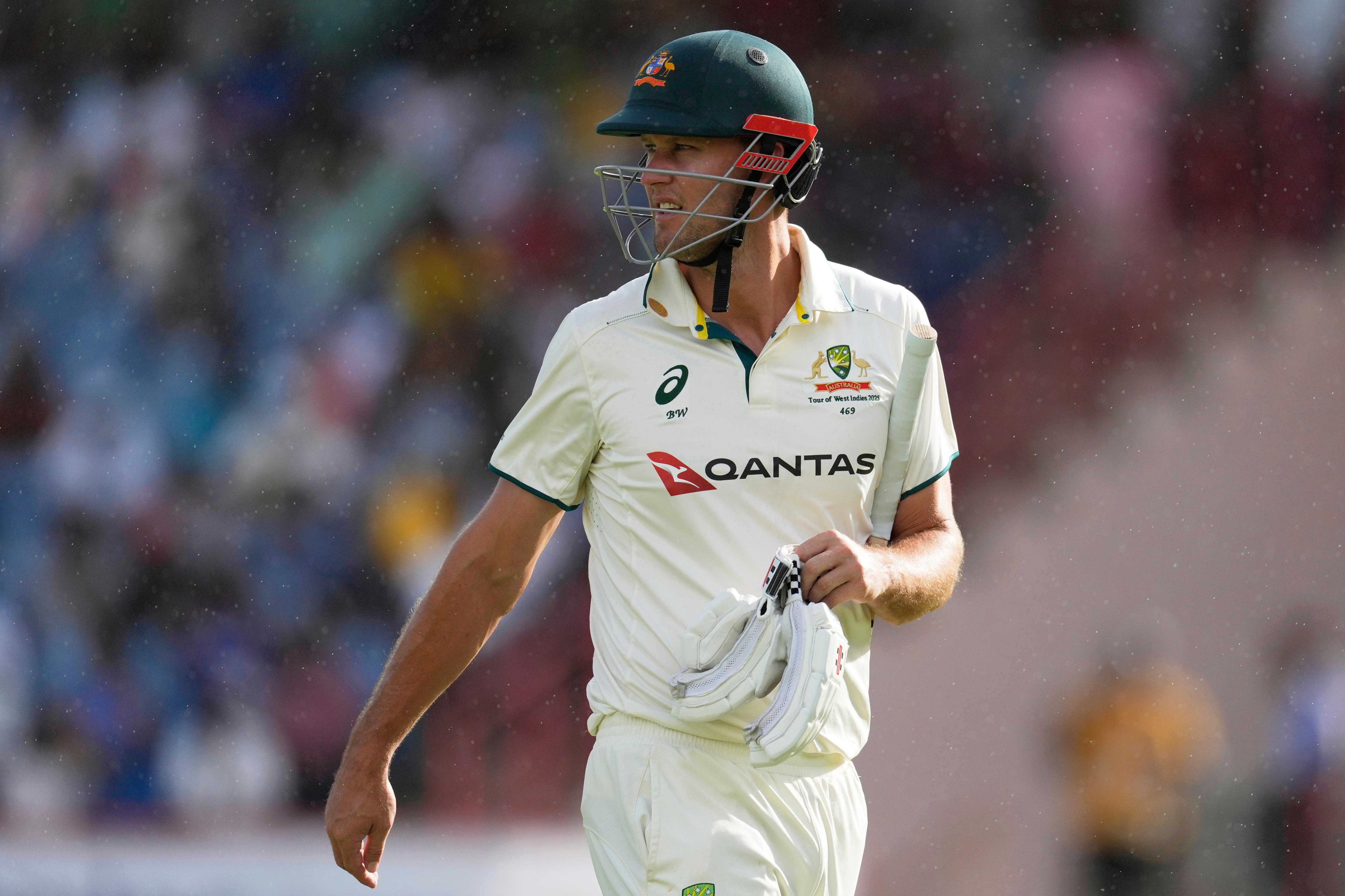 beau Webster walks off in the rain.