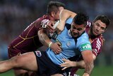 Maroons players tackle NSW's Andrew Fifita